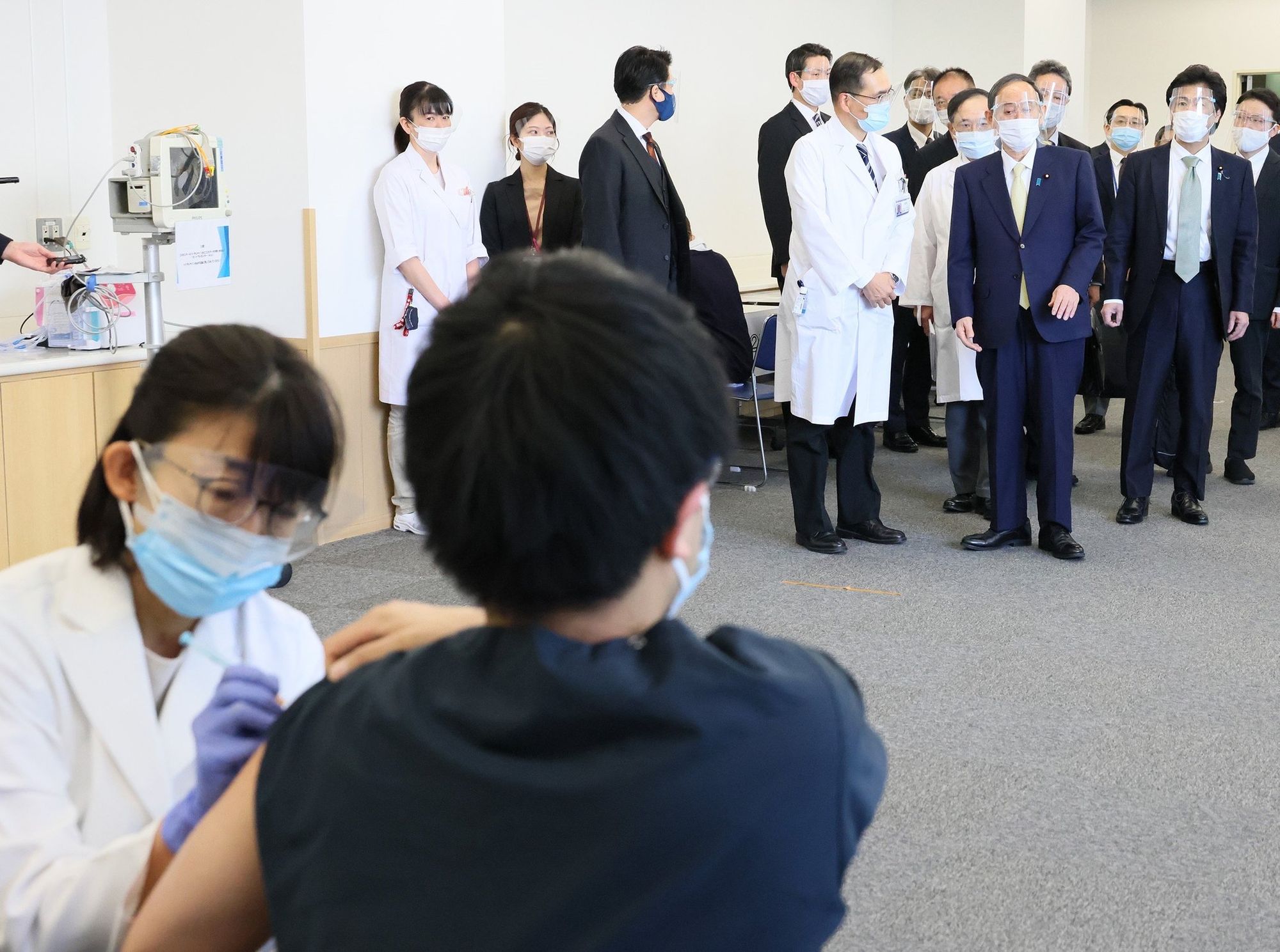 Japan’s Suga Visits COVID-19 Vaccination Site